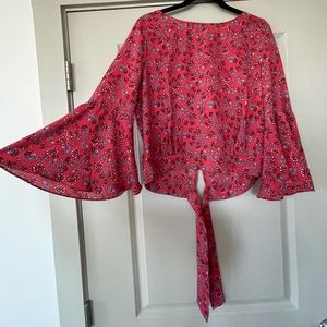 Red floral print blouse with flowy sleeves